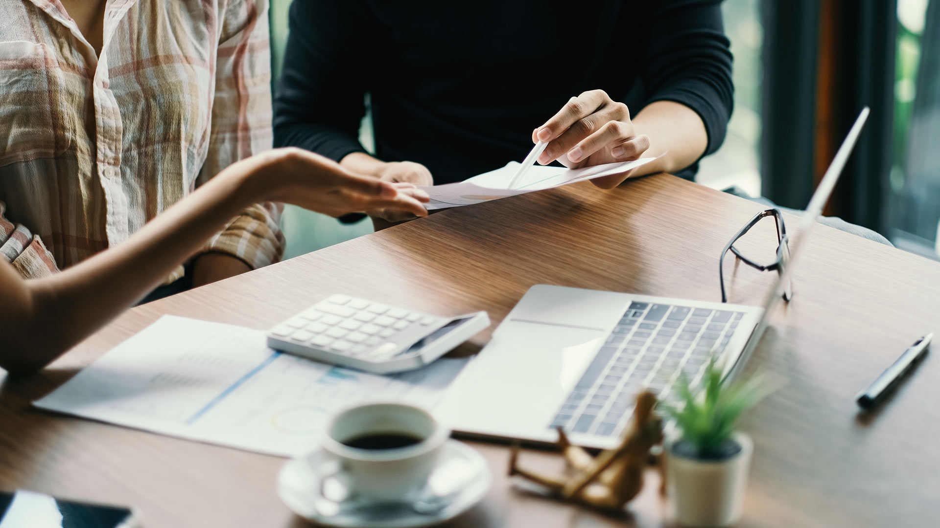 Man and Woman reading a paper